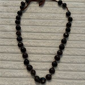 Traditional Hawaiian dark brown KuKui nut necklace.